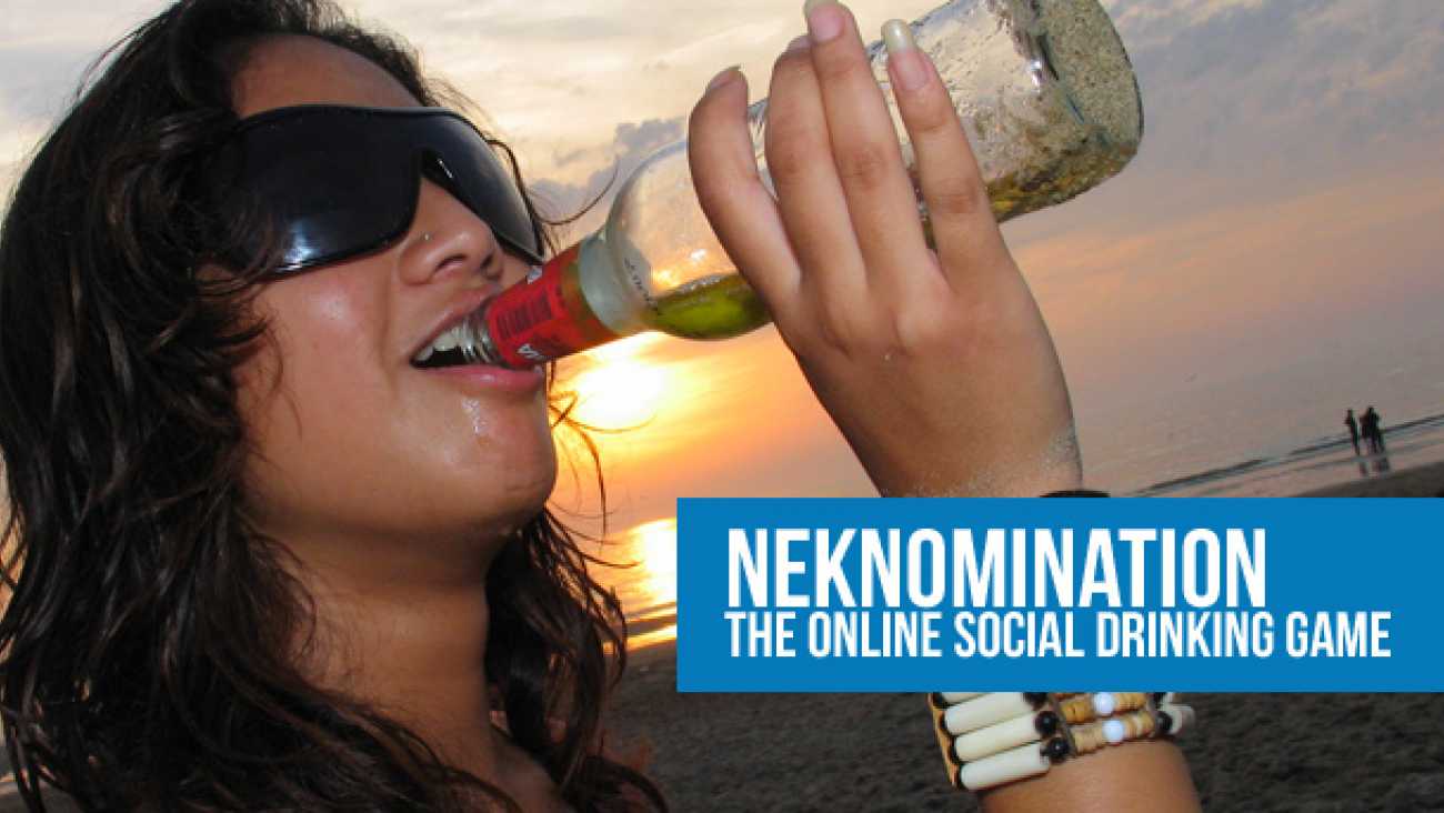 Woman wearing sunglasses drinks from a bottle on a beach at sunset beside the text NekNomination: The Online Social Drinking Game.