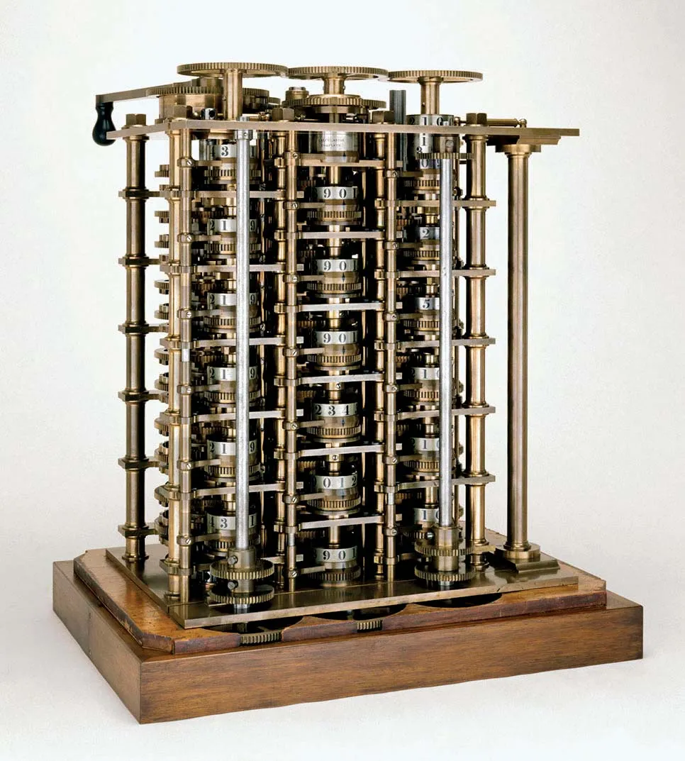Brass mechanical Difference Engine model with stacked numbered wheels, gears and columns on a wooden base.