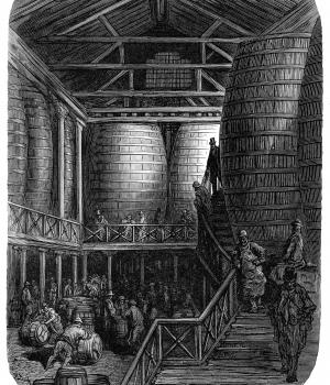 Engraving of a brewery interior filled with giant wooden vats, workers and visitors on stairs.
