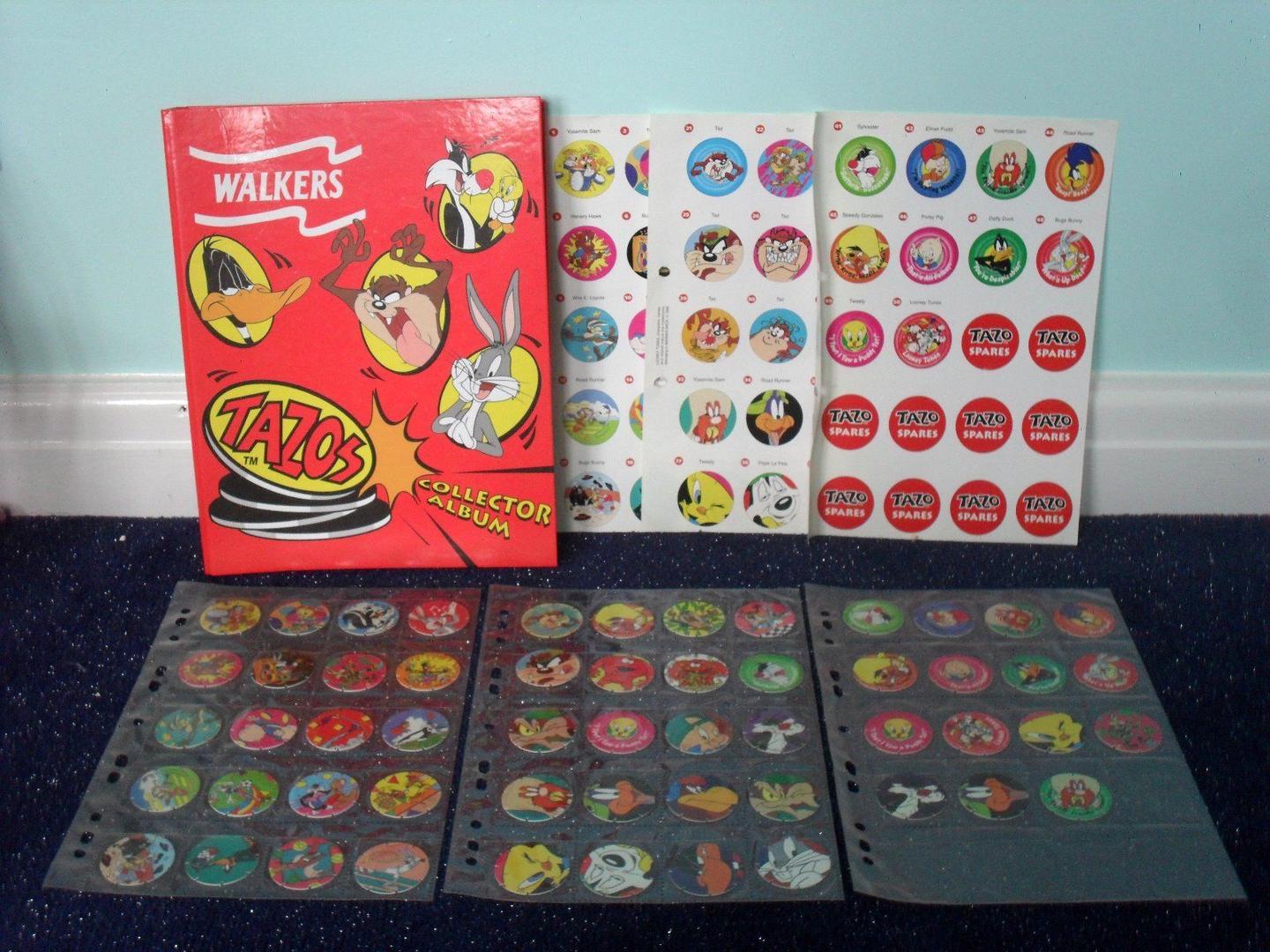 Walkers Looney Tunes Tazos collector album displayed with checklist pages and rows of collected discs.