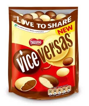 Front view of a red, yellow and brown Nestlé Vice Versas sharing bag on a white background, labeled “LOVE TO SHARE” and “NEW,” with illustrations of pale and brown chocolate pieces, including cutaway pieces.