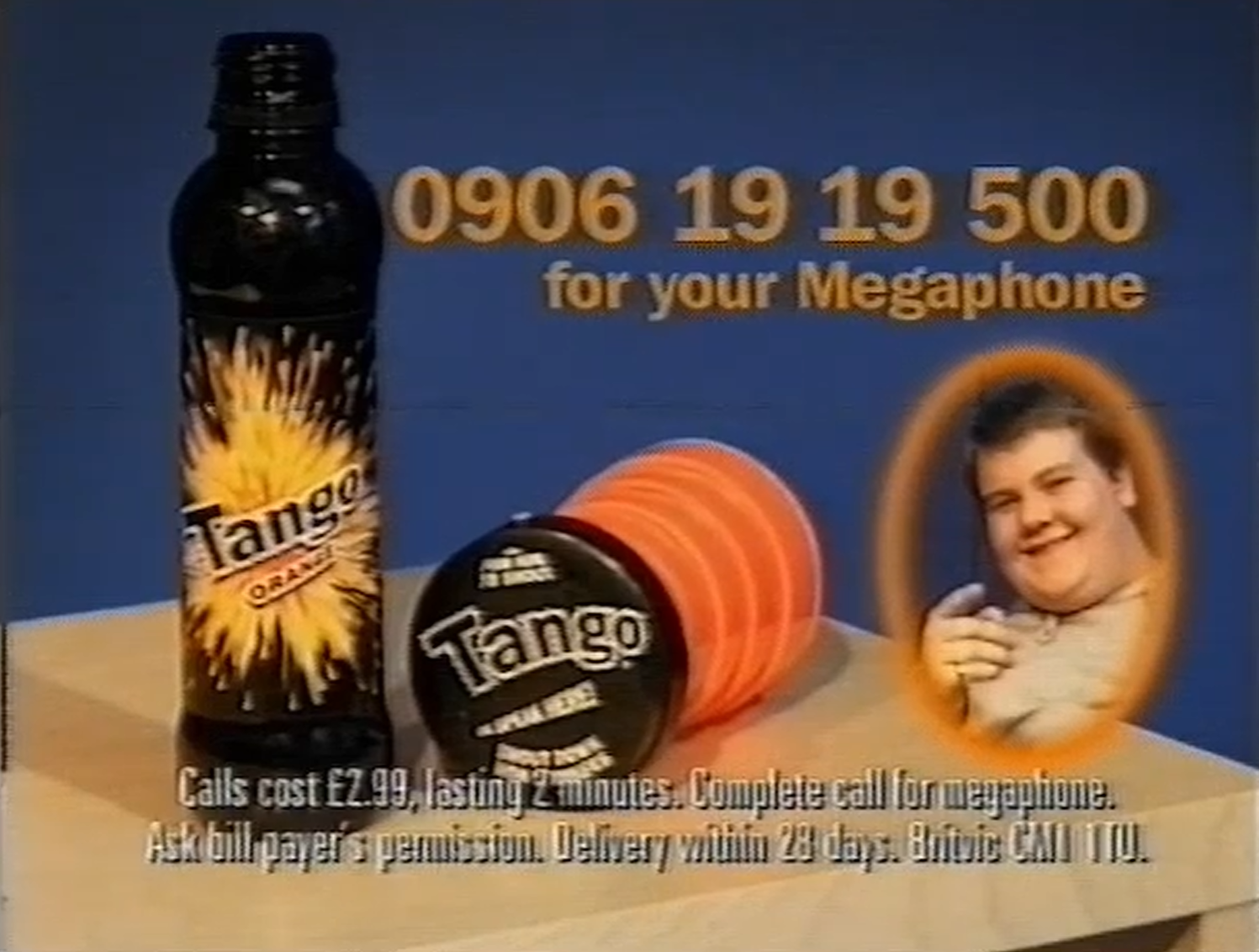 Blue-background Tango Orange promotion showing a black Tango bottle, an orange-and-black megaphone, a portrait of a smiling man, and the telephone number “0906 19 19 500” with call-charge text.