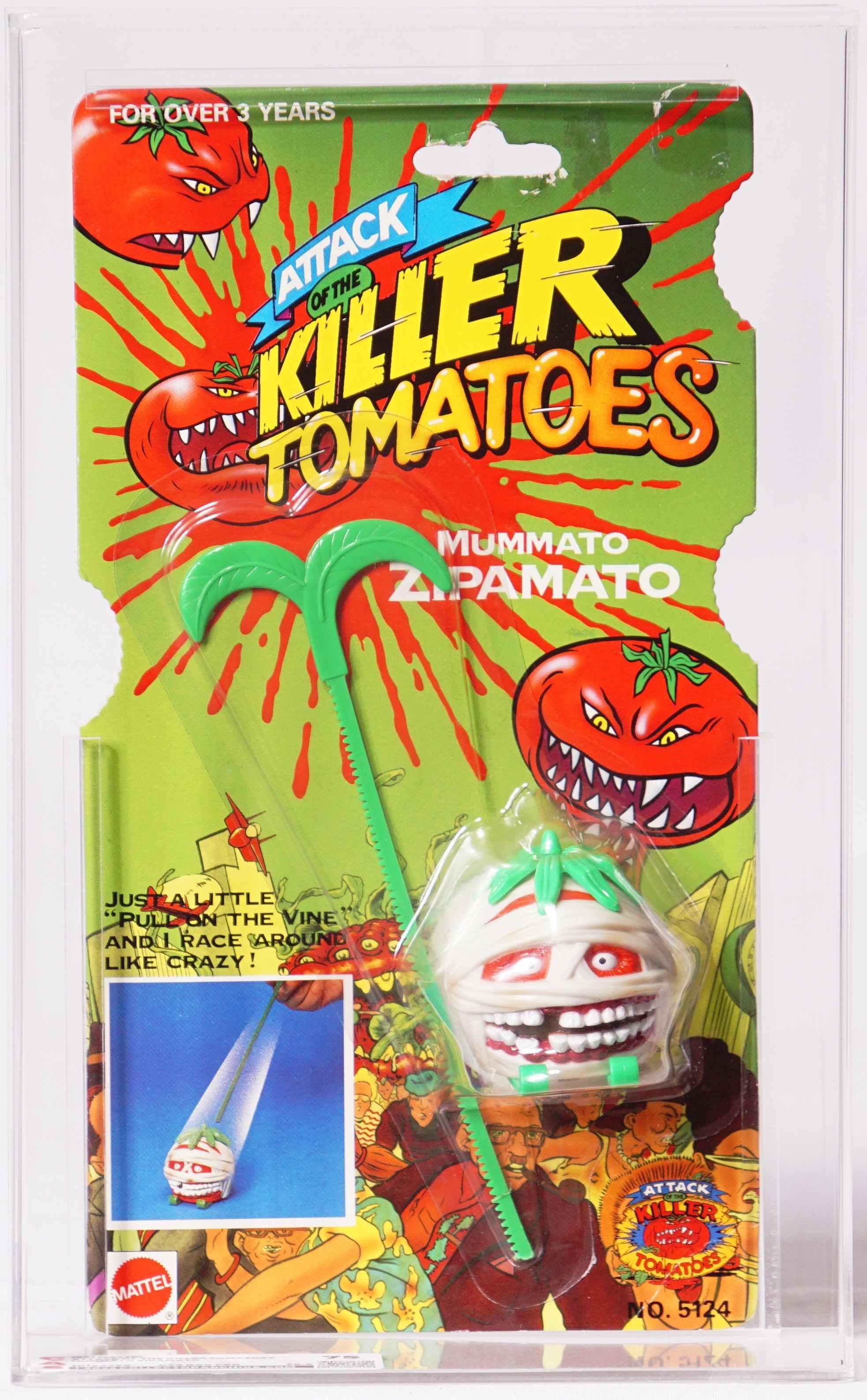 Close-up photograph of the upper and middle front of a sealed Attack of the Killer Tomatoes Mummato and Zipmato package in a clear protective case, showing the green card, red splatters, title logo, bandaged tomato figure, green accessory, and part of the blister.