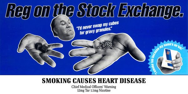 Blue Embassy Regal cigarette advert headed “Reg on the Stock Exchange.” A cut-out head appears above two open hands holding dark cubes and loose tobacco beside the line “I’d never swap my cubes for gravy granules.” A Regal pack and smoking warning appear at right and below.