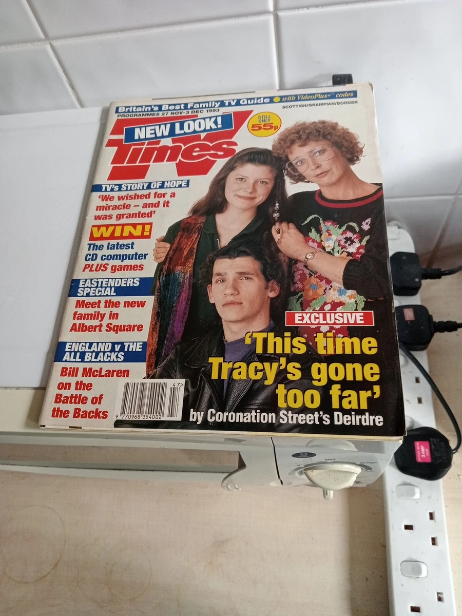 Angled overhead photograph of the cover of a Times television guide dated 27 November–3 December 1993, resting on a kitchen appliance beside a power strip. The cover carries the text “with VideoPlus+ codes” along the top and shows three Coronation Street actors beneath several cover lines.
