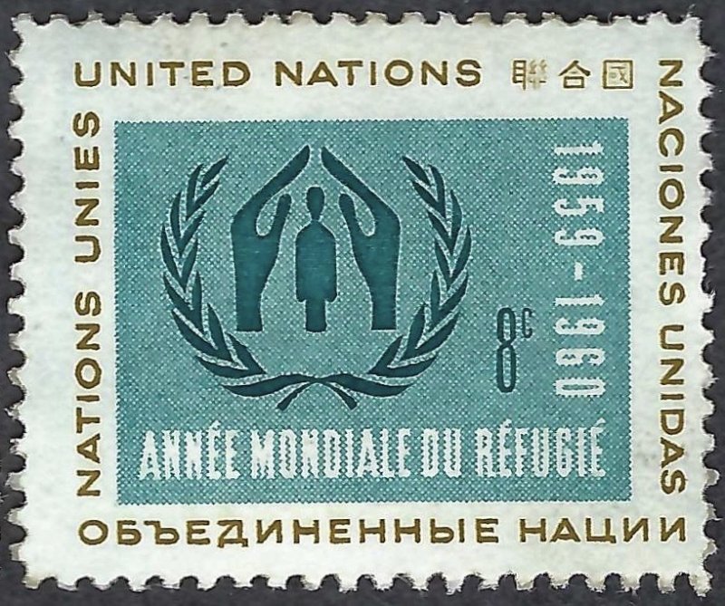 Square perforated stamp in teal, cream and brown. A central teal panel shows two large hands arched over a standing human figure, flanked by leafy branches tied at the bottom. The border reads “UNITED NATIONS” in several languages; the panel includes “1959–1960” and “ANNÉE MONDIALE DU RÉFUGIÉ.”