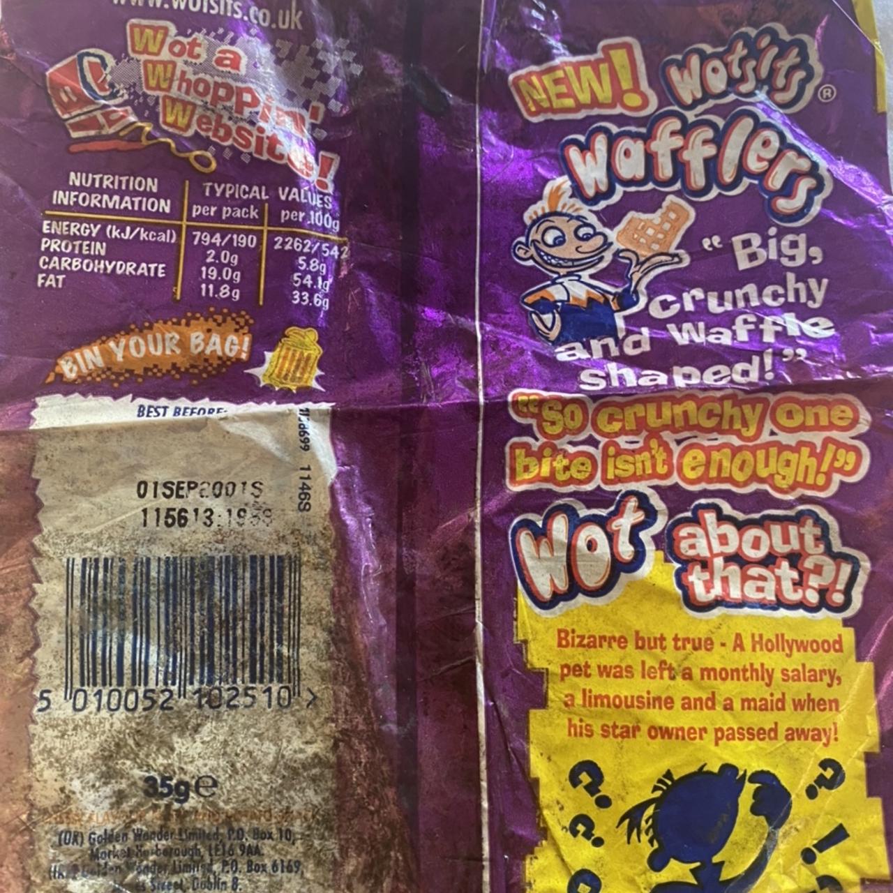 Flattened, creased purple Wotsits Wafflers snack wrapper showing the logo, a cartoon figure holding a rectangular waffle-shaped snack, the phrases “Big, crunchy and waffle shaped!” and “So crunchy one bite isn’t enough!”, nutrition information, a barcode and a printed code label.