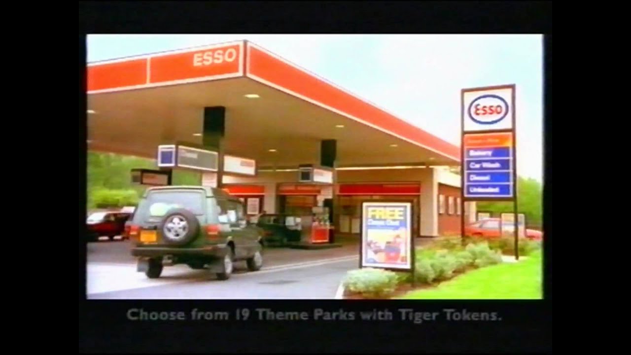 A frame from an advertisement showing an Esso forecourt, a car by the pumps and a caption about choosing from 19 theme parks with Tiger Tokens.