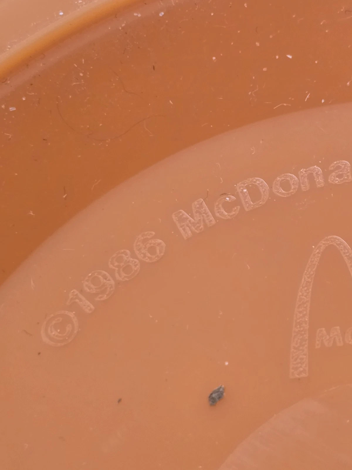 Close view of the printing and underside date marking on a pail.