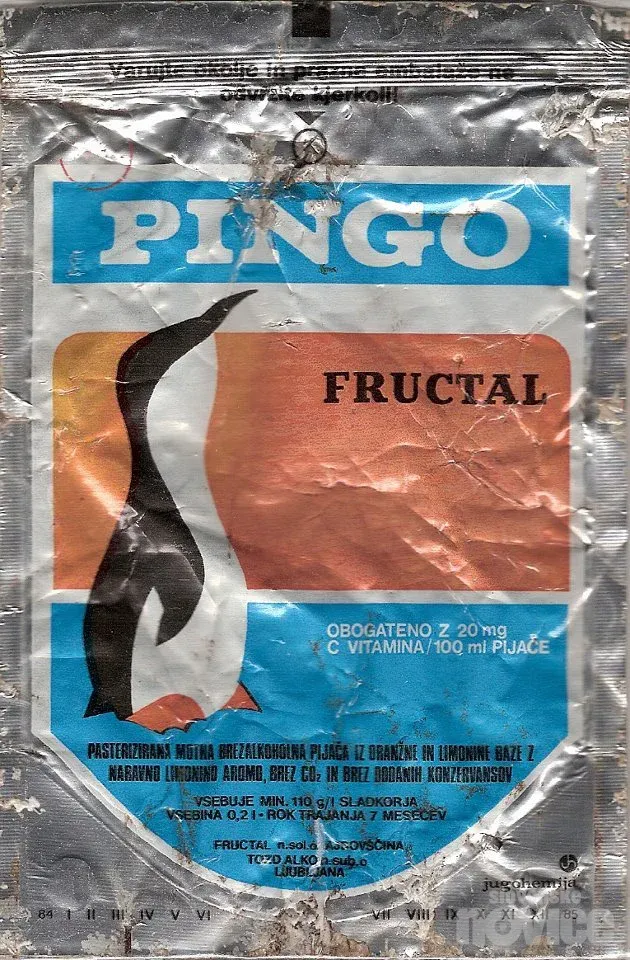 Vintage Pingo fruit drink pouch with silver foil packaging, blue PINGO lettering, orange panel and penguin illustration.