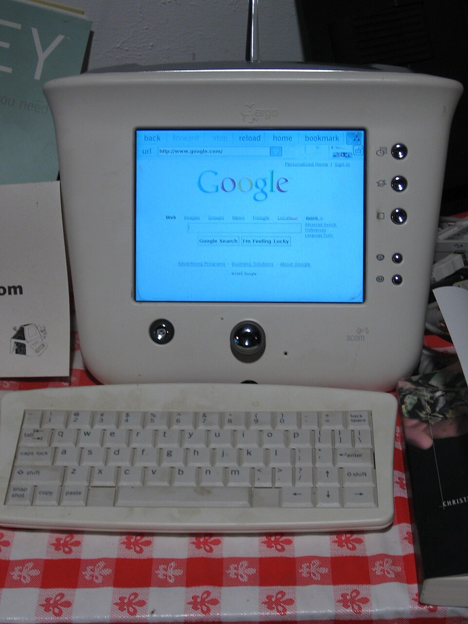 A glimpse of early-2000s internet browsing, when even a simple Google search could involve a dedicated terminal, a small screen and a physical keyboard.