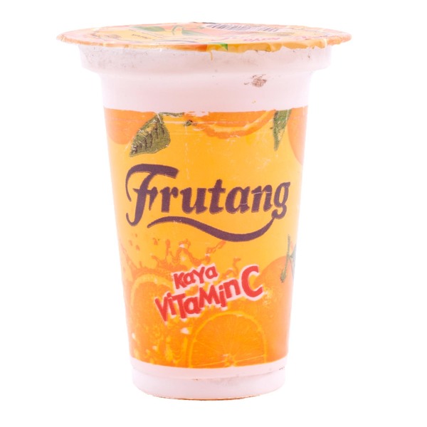 The familiar orange-flavoured cup was an inexpensive childhood refreshment, remembered alongside the small shops and school-day routines of Indonesia.