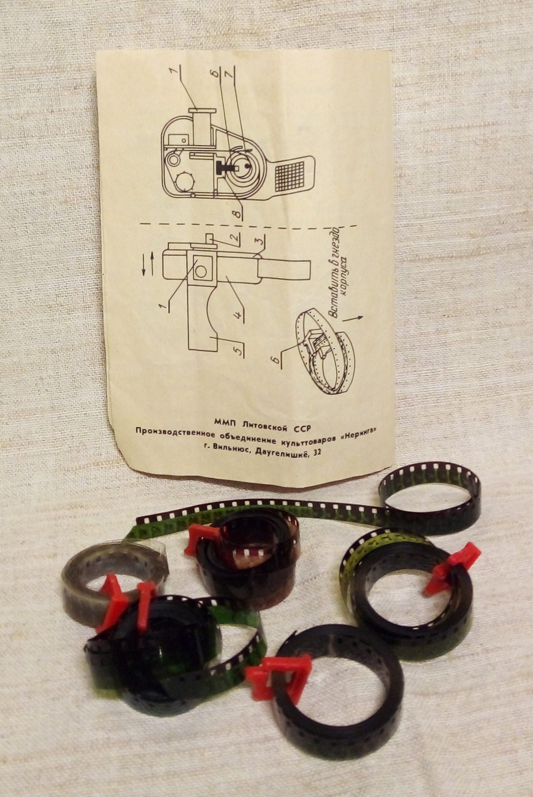 A cutaway diagram reveals the simple optical path that turned perforated loops and a hand crank into a private miniature screening.