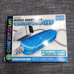 The retail box sold a complicated idea in one picture: a blue adapter linking Nintendo’s handheld to Japan’s digital mobile-phone network.