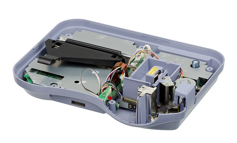 Inside the Loopy, the compact thermal printer occupies almost as much visual space as the game electronics.