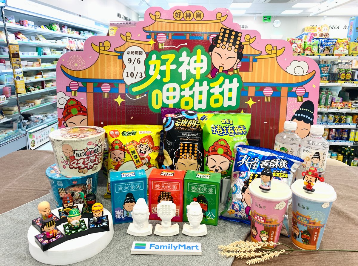 A colourful FamilyMart shop display filled with Good Gods figurines, branded snacks, cups and promotional decorations.
