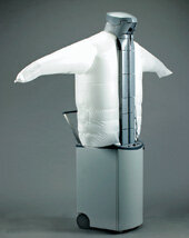 Siemens dressman appliance with a pale inflated torso and outstretched short sleeves on a tall grey wheeled base.
