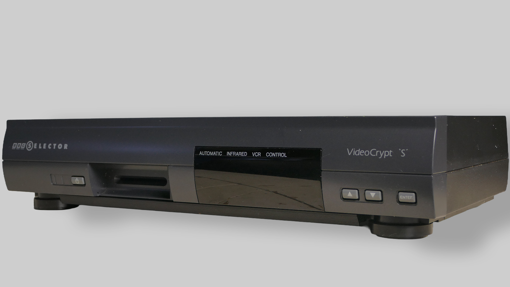Dark grey BBC Selector receiver-decoder with VideoCrypt S lettering, an exposed card slot, and three front-panel buttons.