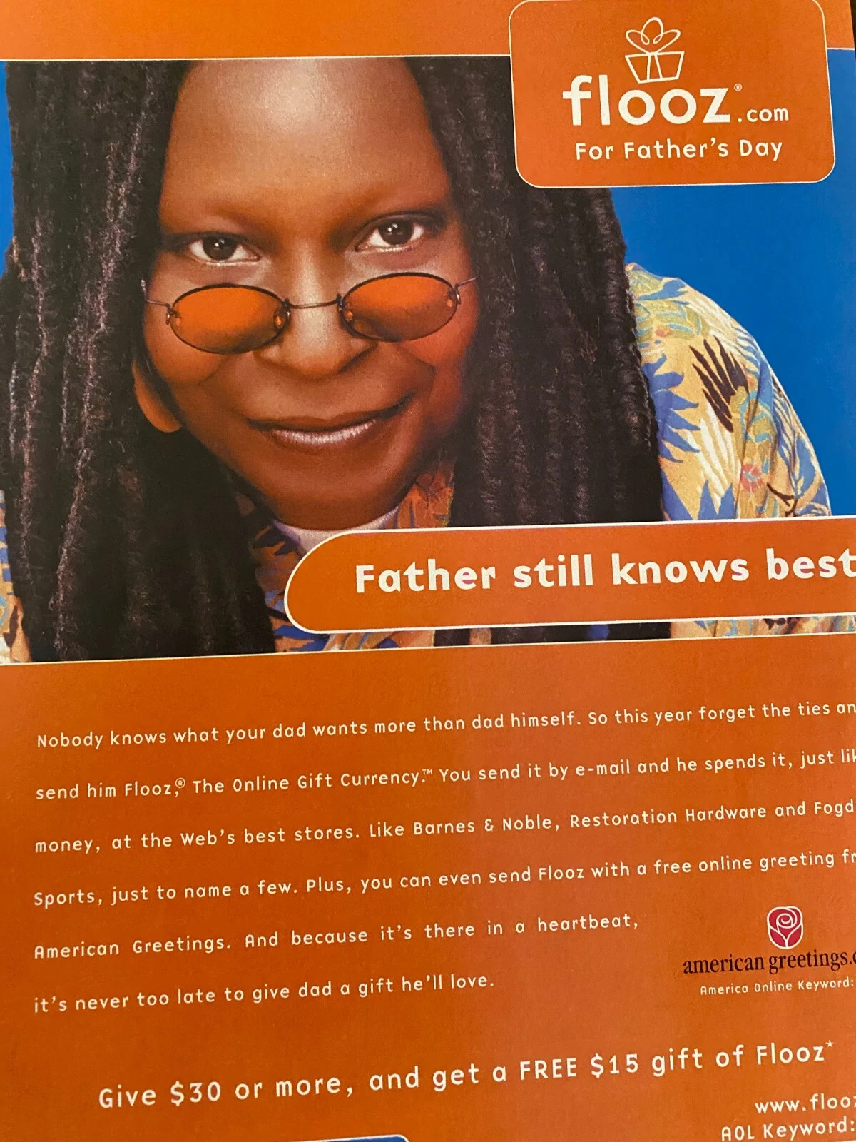 An orange and blue Flooz.com Father’s Day print advert features Whoopi Goldberg in orange-tinted glasses, the headline Father still knows best and copy explaining emailed gift currency; the photographed page cuts off at the right edge.