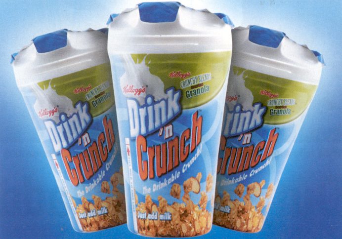 Three blue-and-green Kellogg Drink ’n Crunch Granola cups against a blue background, with white shaped lids and cereal illustrations.