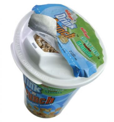 Beneath the foil, an inner compartment held the granola while the outer cup held the milk, keeping them separate until it was time to eat.