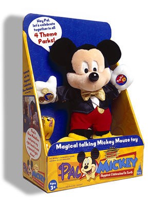 Boxed Mickey Mouse plush wears a black tuxedo jacket, gold bowtie, red shorts and yellow shoes, in blue-and-yellow Pal Mickey Happiest Celebration on Earth packaging.