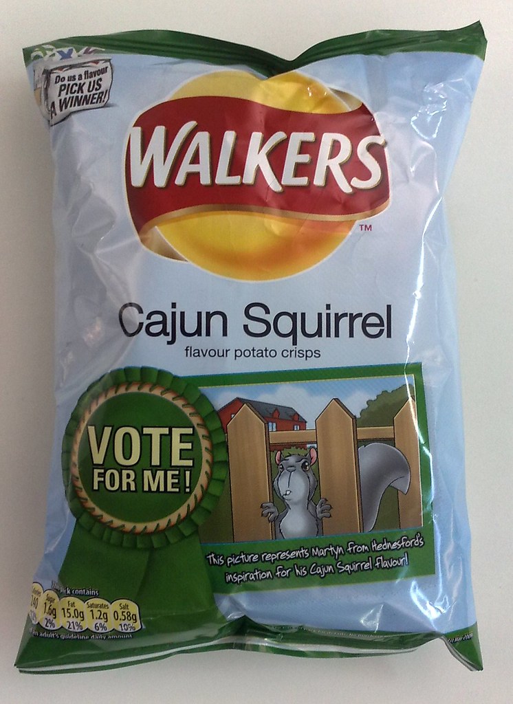 Cajun Squirrel carried the competition’s invitation to vote directly on its packet. The front also credited the entrant’s inspiration, giving a public suggestion a visible place in the brand’s packaging.