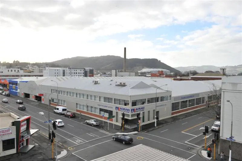 Big Fresh’s buildings outlasted the supermarket name. Linda Robertson’s later photograph shows the former Dunedin premises reused by other businesses, a surviving physical trace of the vanished chain.