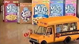 Low-resolution television frame with four Mini-Wheats cereal packages behind a yellow school bus marked “Mini-Wheats Academy,” with small images visible in the bus windows.