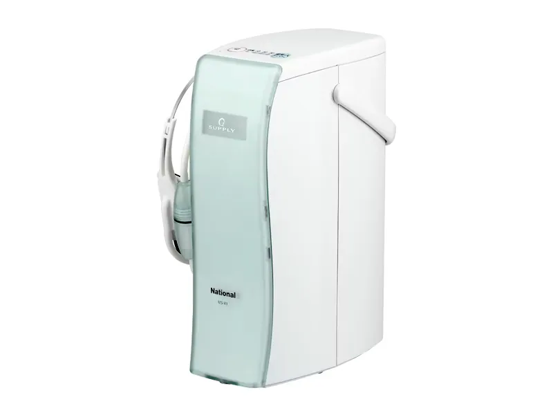 White National MS-X1 oxygen air charger with a pale-green front panel, carrying handle and headset tubing stored along its left side.