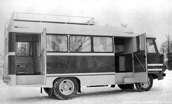 Black-and-white side view of a TA-942T service bus with its side and rear doors open.