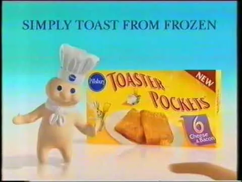 Television end card on a turquoise background with the Pillsbury Doughboy beside a yellow box labeled “Pillsbury Toaster Pockets.” Text across the top reads “SIMPLY TOAST FROM FROZEN,” and the package shows two browned triangular pockets, a red “NEW” corner label, and a purple panel marked “6.”