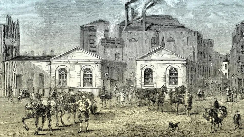 Historic engraving of a London brewery courtyard with horse-drawn barrel carts and smoking chimneys.