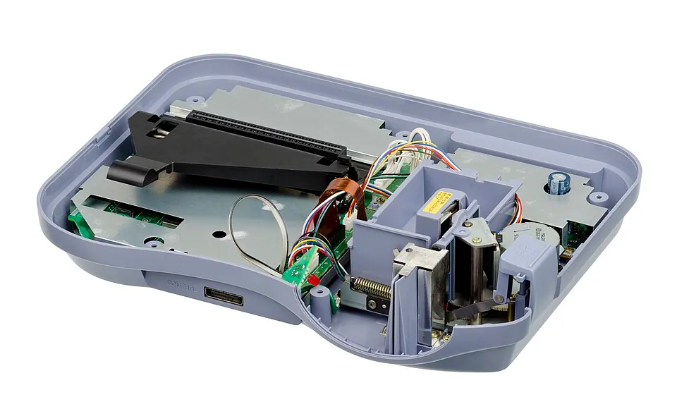Casio Loopy console with its upper shell removed, exposing the circuit boards, wiring and thermal printer mechanism.